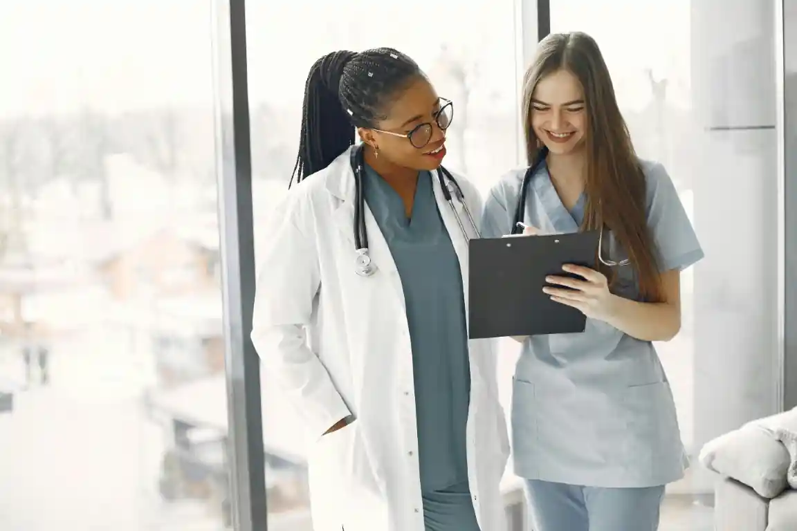 Healthcare professionals reviewing performance data